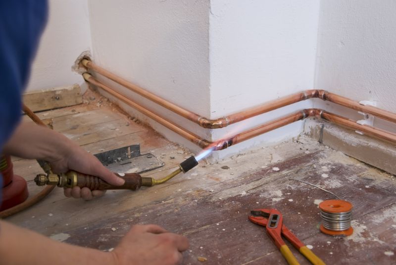 emergency-plumber-soldering-copper-pipes-min